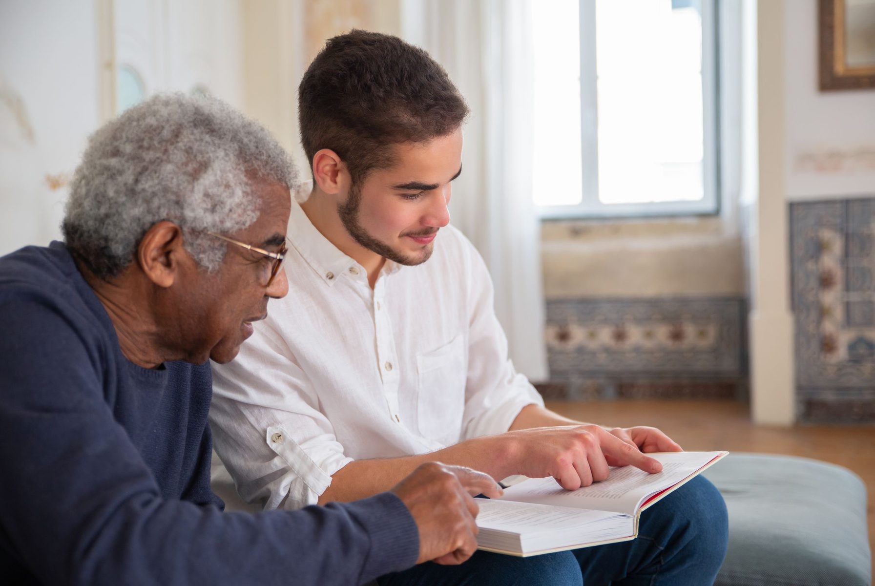 Matt going through a care plan with an elderly client at home